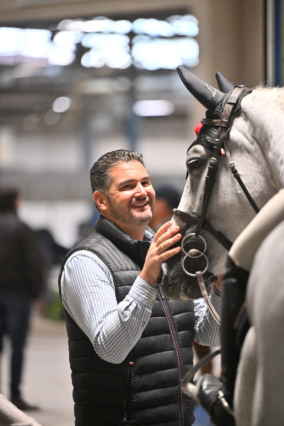 Trainer Salvatore Gandolfo Jr. with a grey horse